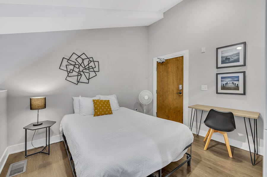 This second floor loft style bedroom also has direct elevator access with this featured door