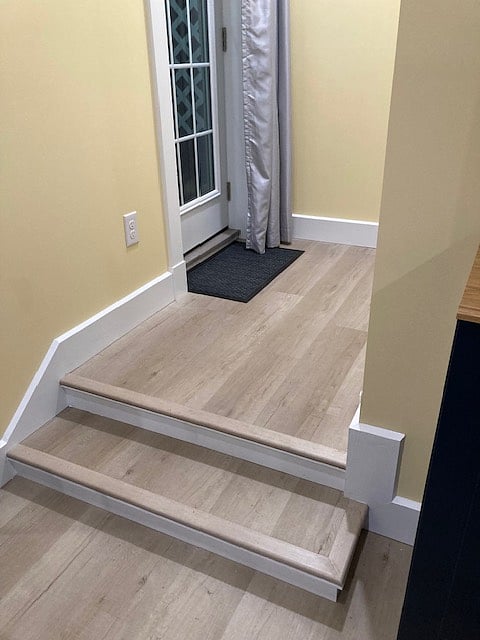 Steps up to Closet and rear door to Courtyard/Patio.