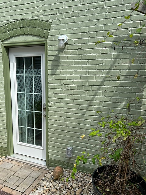 Rear entrance windowed steel door w/blackout curtain, from Courtyard/Patio.