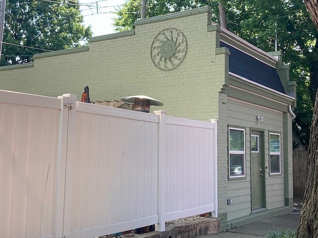 Front and Courtyard-side of studio, with privacy fence and inside-opening only gate.