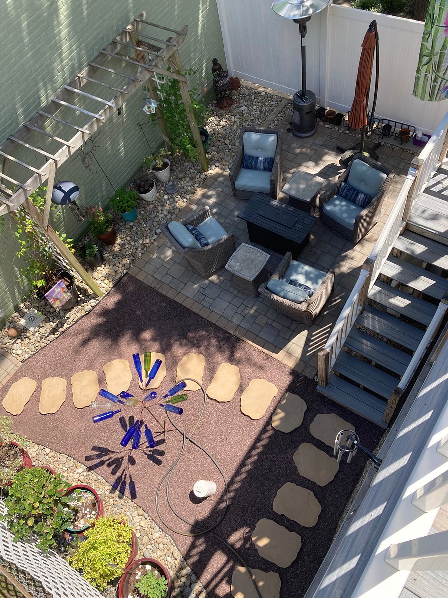 Fenced Courtyard/Patio w/gas heater, umbrella. Weber Gas grill and utensils not shown but are stored under the steps to the duplex steps.