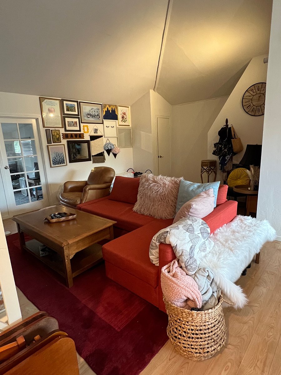 Main living room area. Contains couch, benches, reading area, Smart TV entertainment with access to most of the streaming apps.