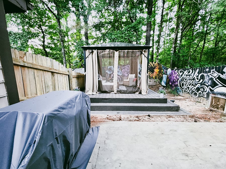 Outside there's a grill and covered deck area