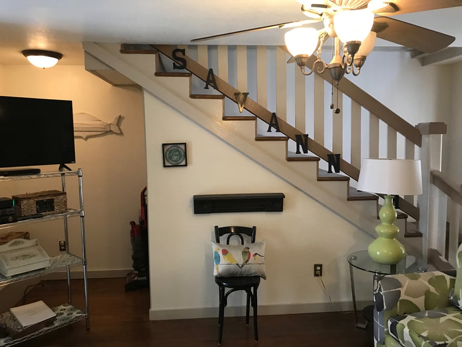 Smart TV, games and decor as you exit and turn to the rear of the first floor toward the bedroom/bath