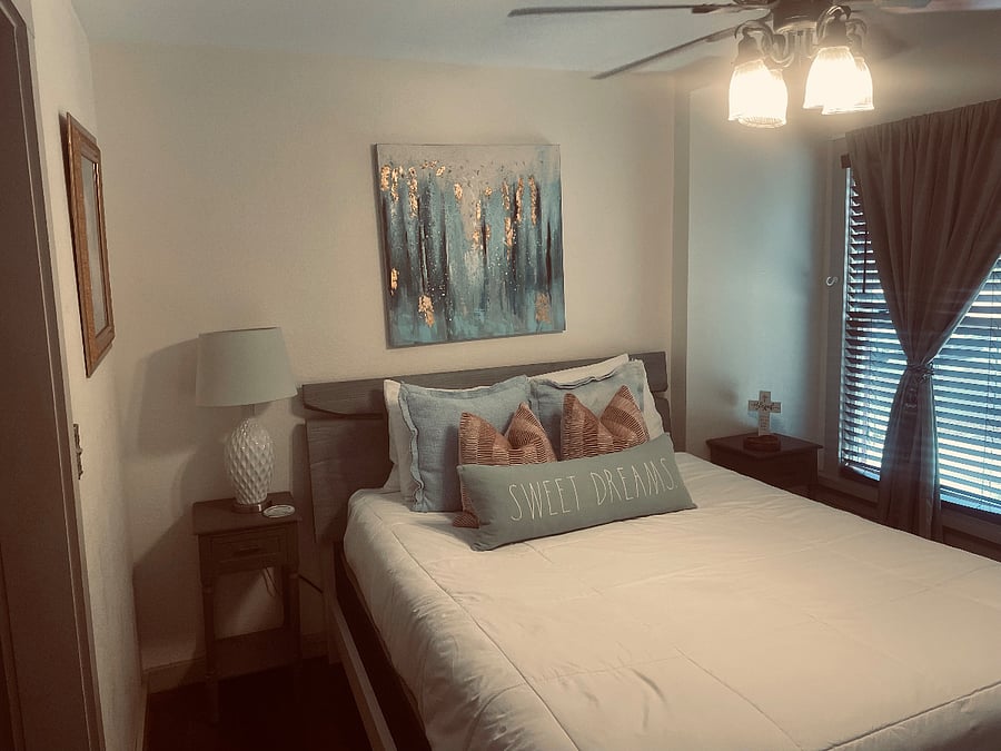 Tall double paned windows spill light...black out curtains and plantation blinds for slumber