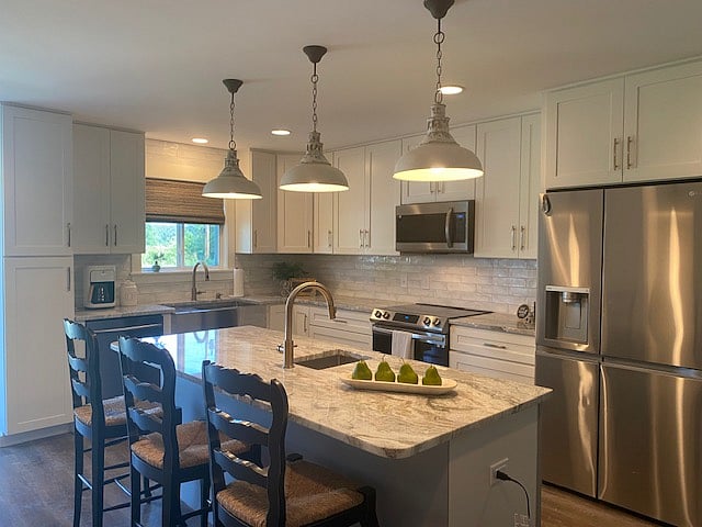 Enjoy preparing dinner in the oversized kitchen and chatting with friends at the oversized island. Easy cleanup at the farm sink while taking in the views of the countryside.