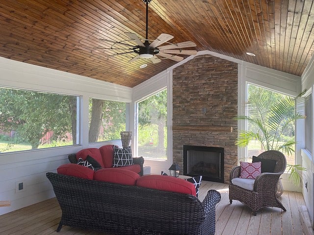 On the screened porch enjoy the stacked stone fireplace and bead board ceiling with remote control ceiling fan. Screened area flanks the fireplace to enhance the views. 