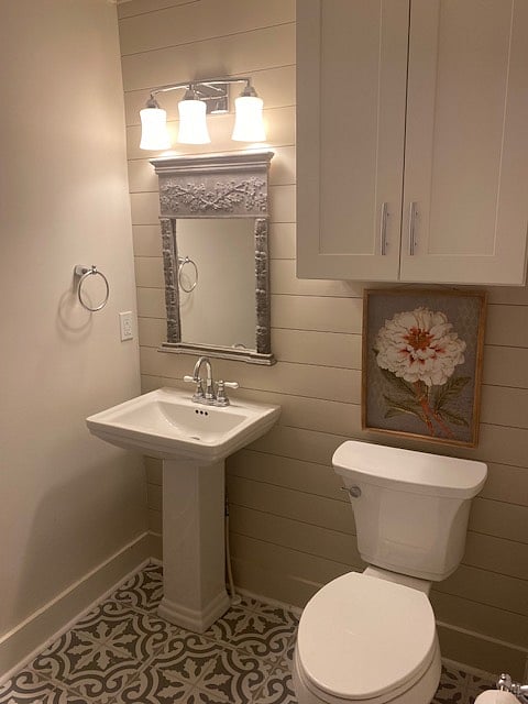Half bath with ship lap is just off the kitchen.