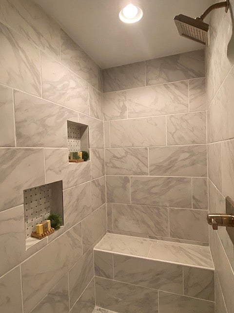 The primary bath shower is fully tiled. 
