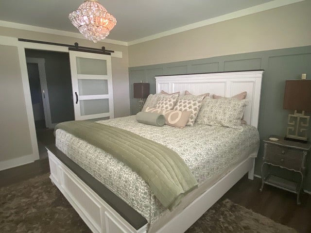 The primary bedroom offers a bed fit for a King and Queen! Barn door adds extra privacy to the primary bathroom which features a large walk-in closet. A T.V. is also located in the primary suite.