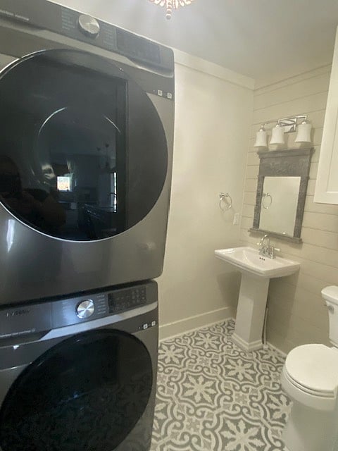 Stackable washer & dryer is located in the half bath.