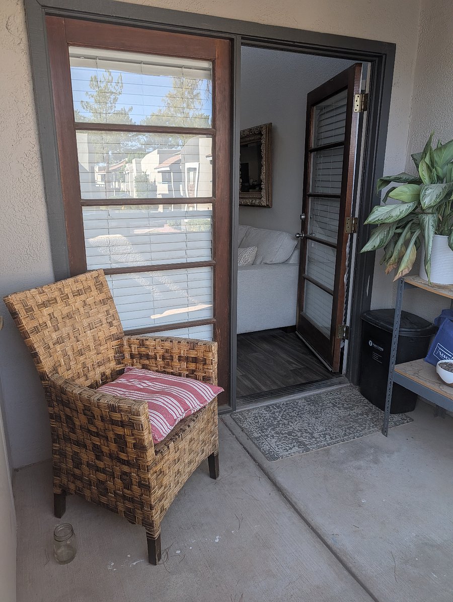 Peaceful, lovely balcony with unobstructed view of trees and landscape areas.
