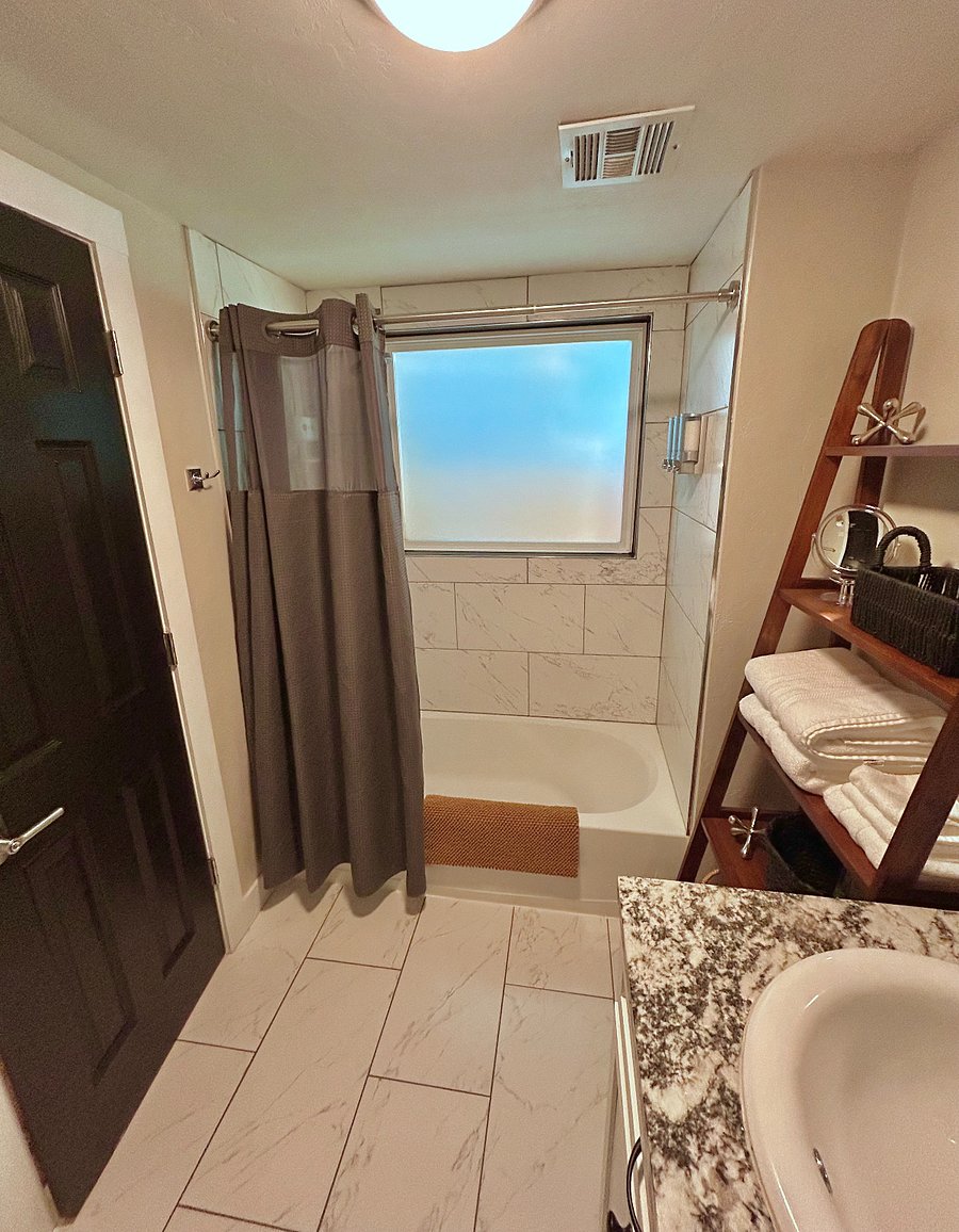 Second bathroom with full size bathtub. 10X makeup mirror, ionizer blow dryer, upgraded linens and toiletries.