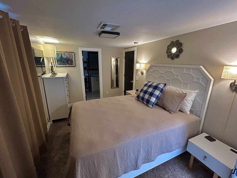 Second bedroom. Black-out curtains, 42" Samsung smart tv. Laptop tray for working from home. Two dressers, pedestal fan.