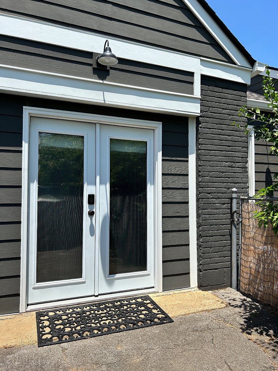 Studio entrance (ribbed privacy film on glass). The gate to the right is where we enter our side of the home.