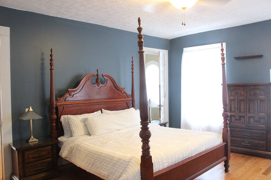 The master features a king size mattress, walk-in closet, dresser, sitting area, vanity and oversized mirror. It also has a fireplace!
