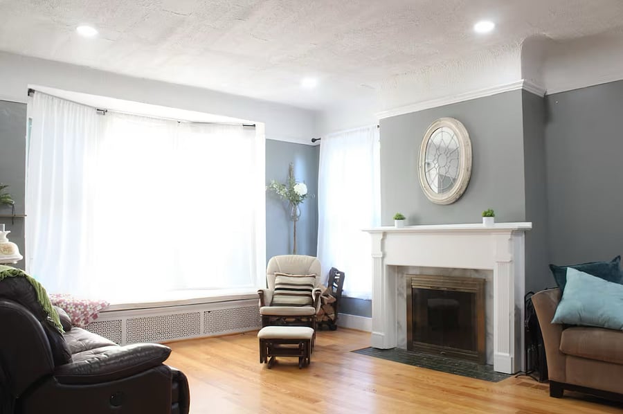 The living room features a wood burning fireplace and a leather auto reclining love seat (the most comfortable recliner ever!)