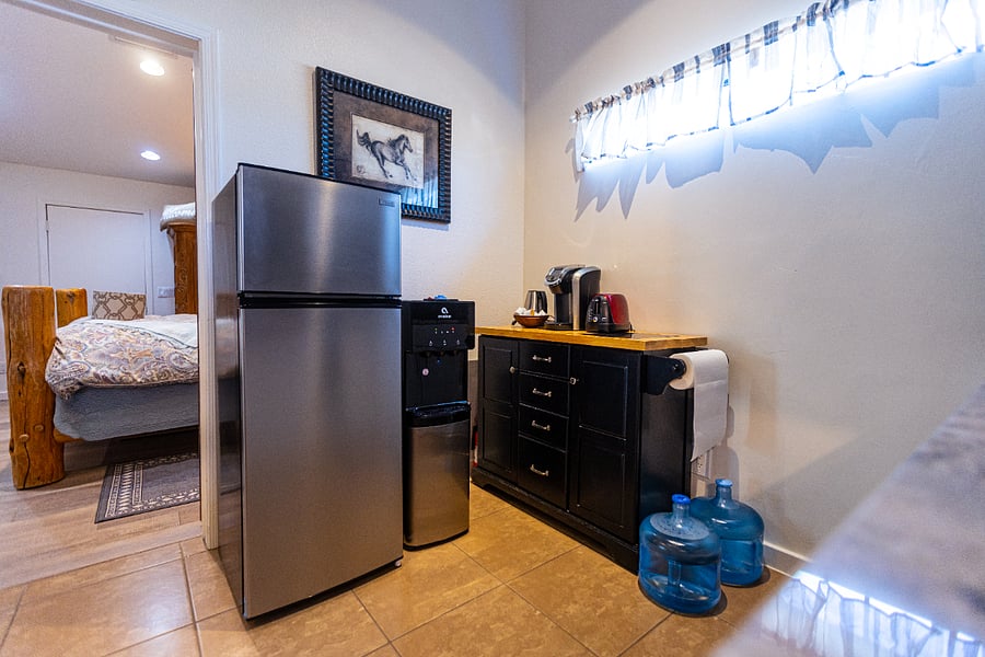 Fresh water dispenser next to the refrigerator