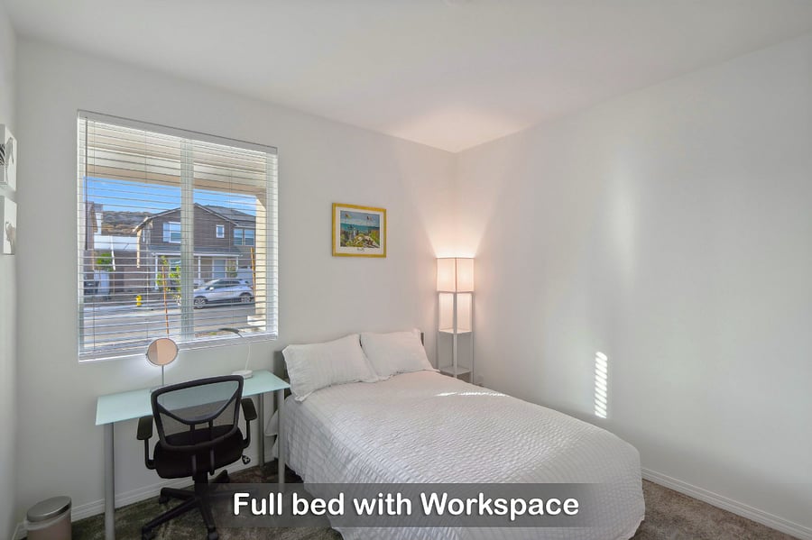 Full bed with a workspace, perfect for a comfortable stay and getting things done.