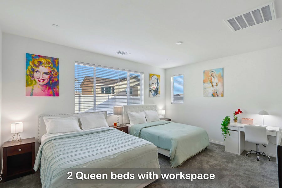Two queen beds with a dedicated workspace for your convenience.