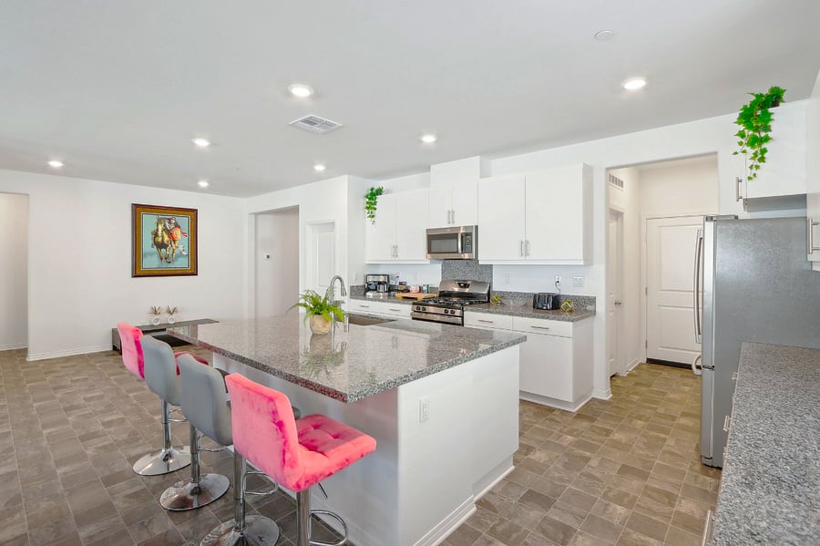 Stylish kitchen island with high chairs, perfect for casual meals and lively conversations!