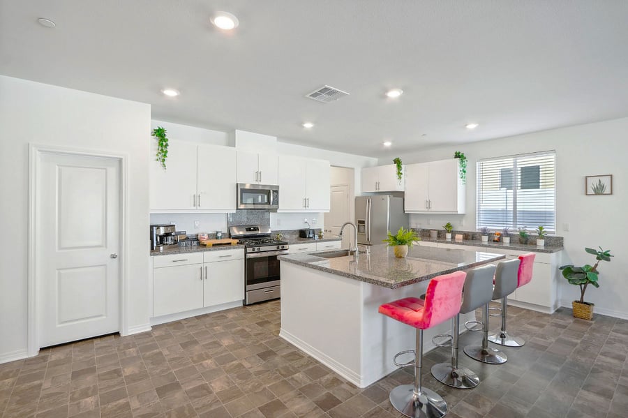 The kitchen and kitchenette are equipped with essential cooking tools, including a gas stove, coffee machine, microwave, fridge, and dishwasher.