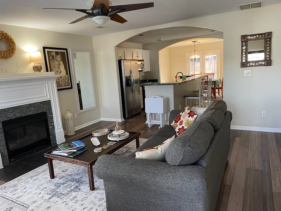 Open floor plan with lounge kitchen dining room with French doors opening to the garden