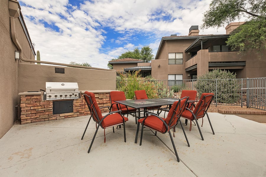 Community grill and seating area at east pool
