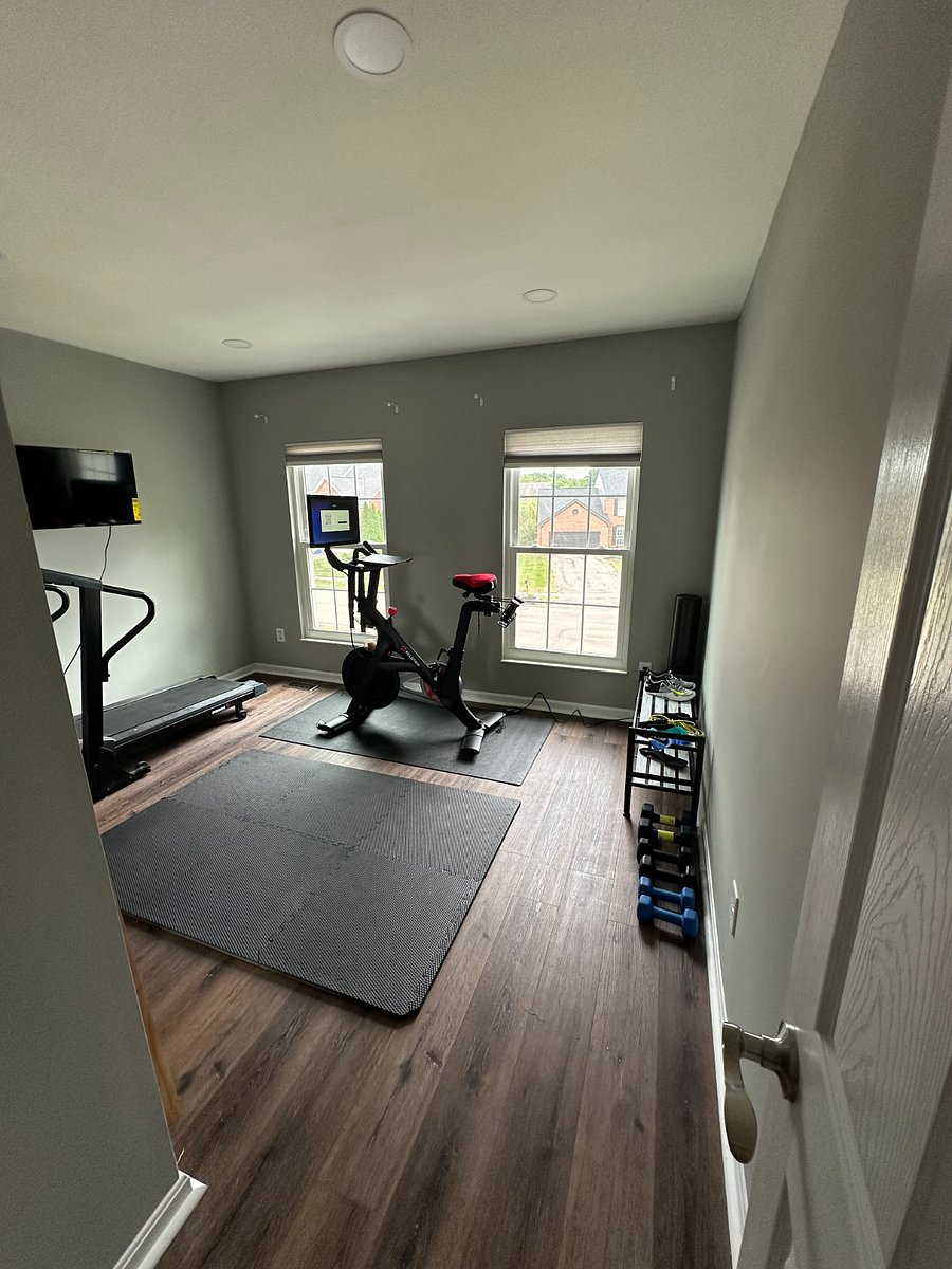 Drop the gym membership - you've got a workout room right at home! Upstairs bedroom converted to a workout room includes 24" smart TV, Peloton bike, various sized free weights, and treadmill.