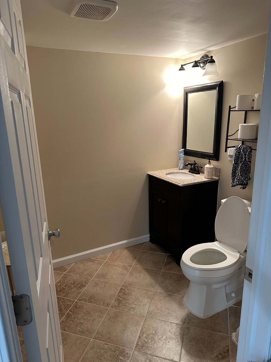Basement oversized half-bathroom with space to change before and after hitting up the hottub