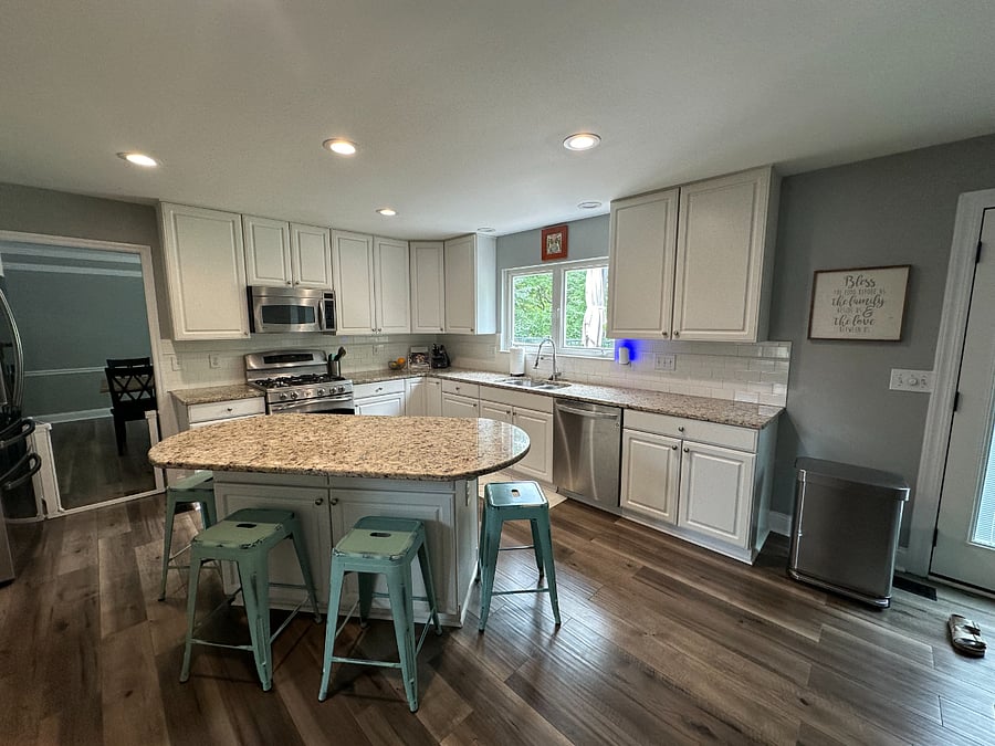 Great open kitchen with fridge, oven, microwave, dishwasher, garbage disposal. Bar stools at the island. French doors to the right, that lead out to your beautiful deck!