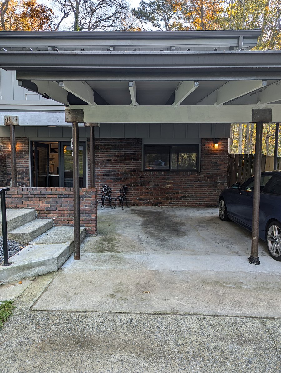 Carport stall for parking + in-law suite's separate entrance