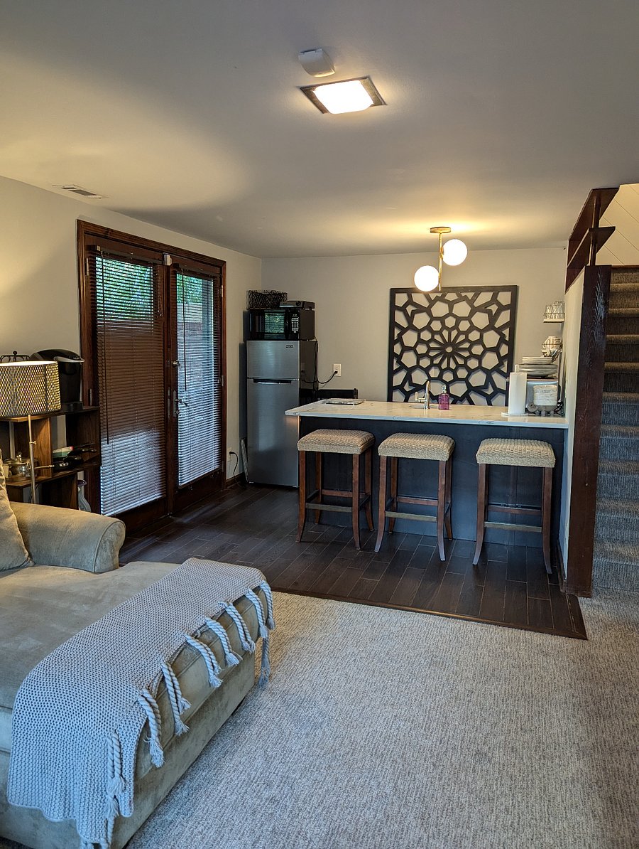 the kitchen from the living room + the stairs which lead to the owner's space (door is locked between the two)