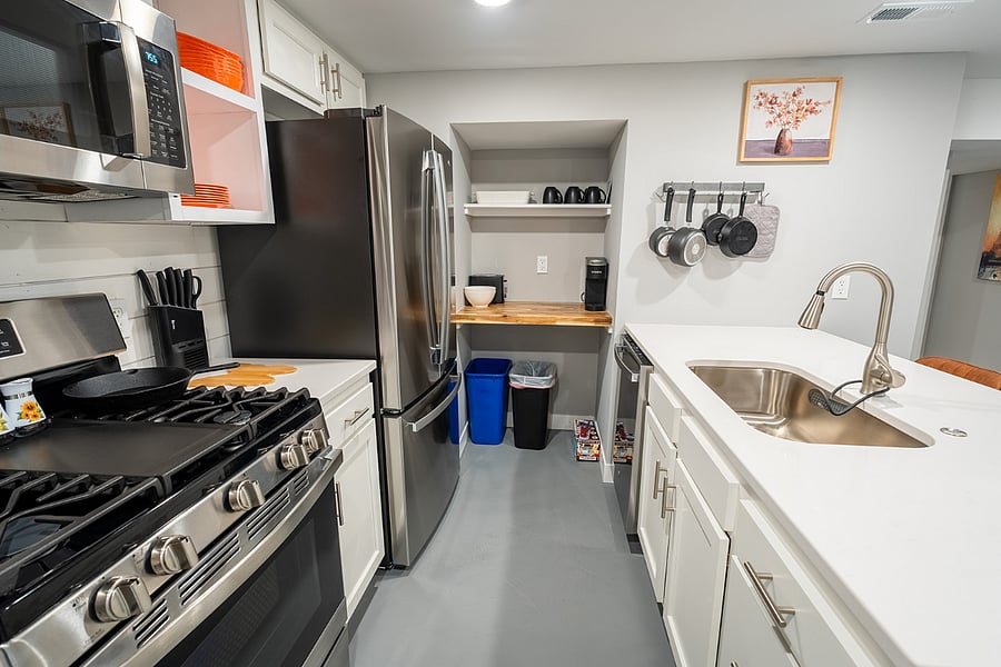 Gas cook top and french door fridge, with large in counter stainless sink in the island