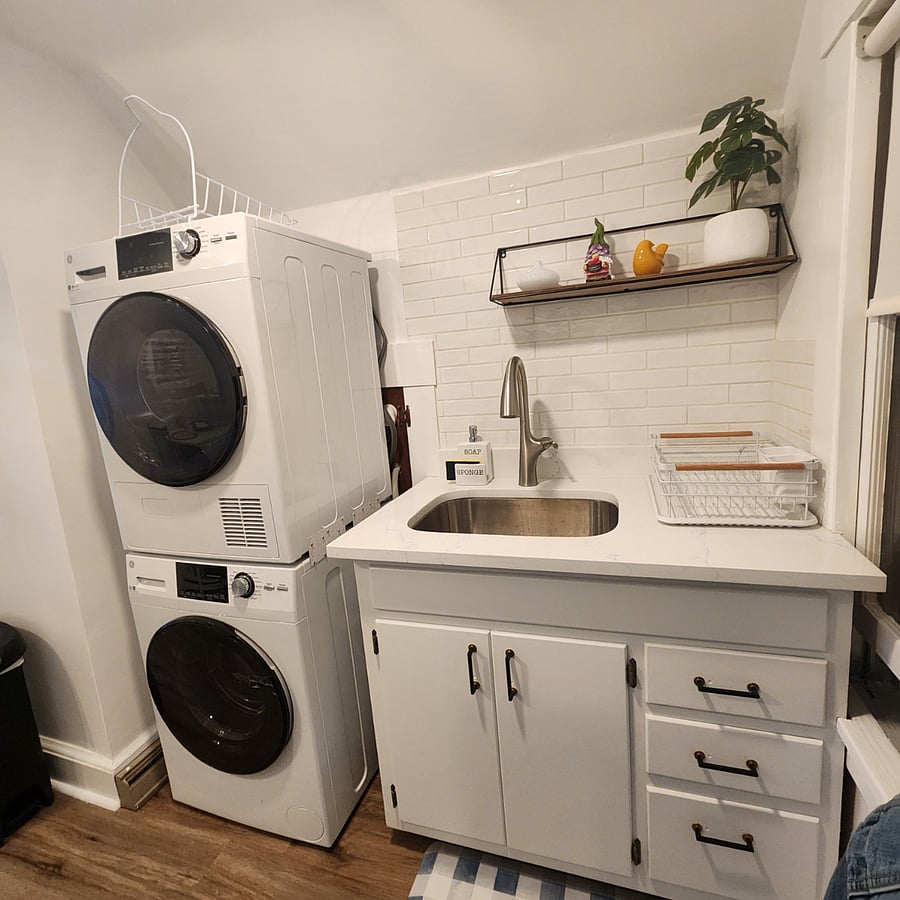 Kitchen with a full washer and drier.