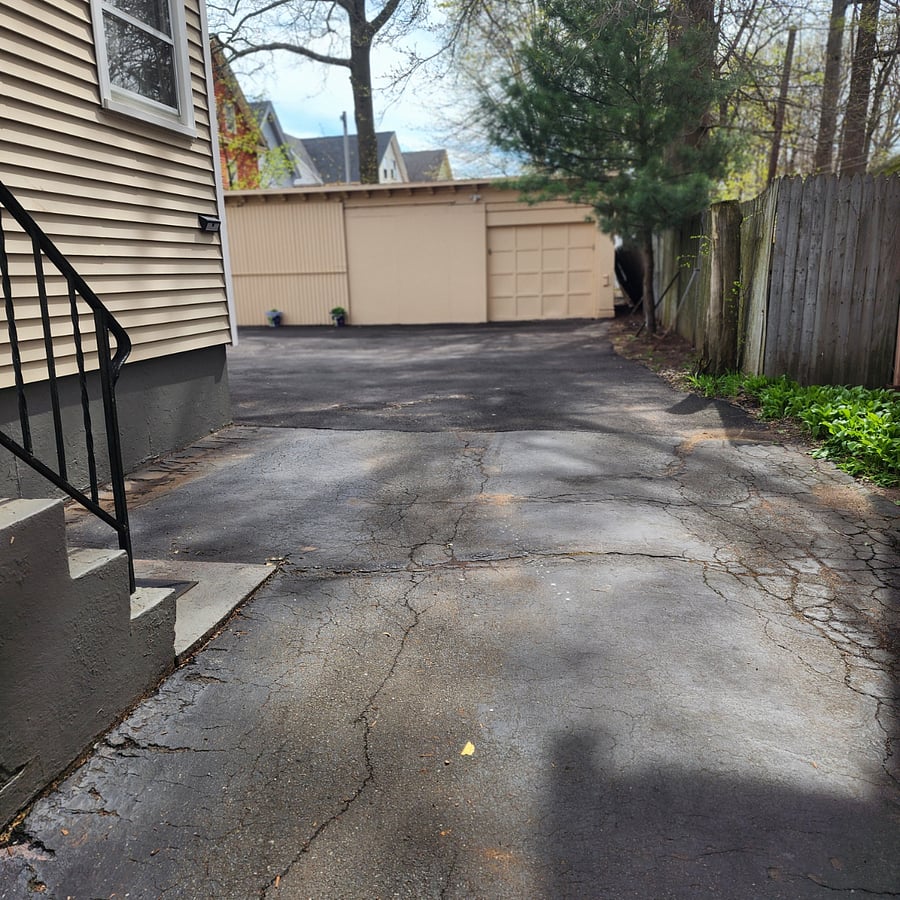 This is the driveway that leads to the parking spaces.
