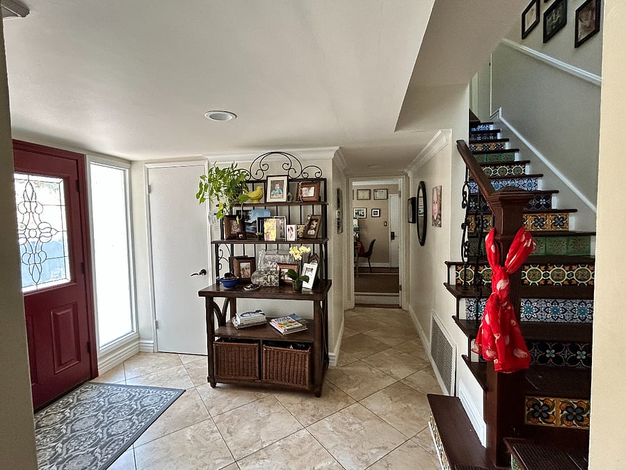 Entry through red doors and room/bath upstairs