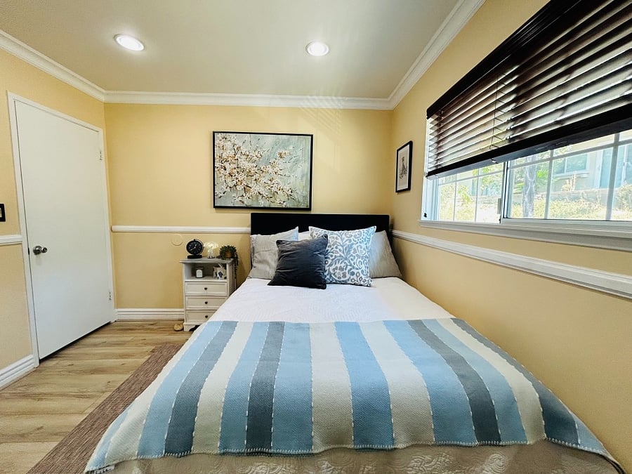 Bedroom. Brand new flooring (2/24), brand new bed & mattress (7/24), brand new smart TV (7/24), brand new desk/chair (7/24).