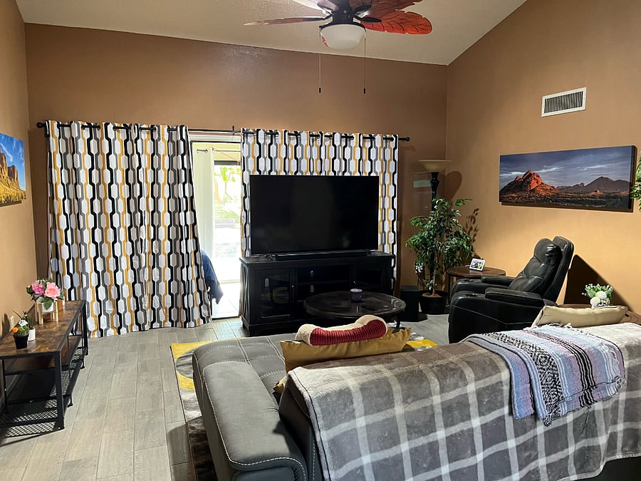Another view of middle wing front room leading to 3rd BR and rear patio