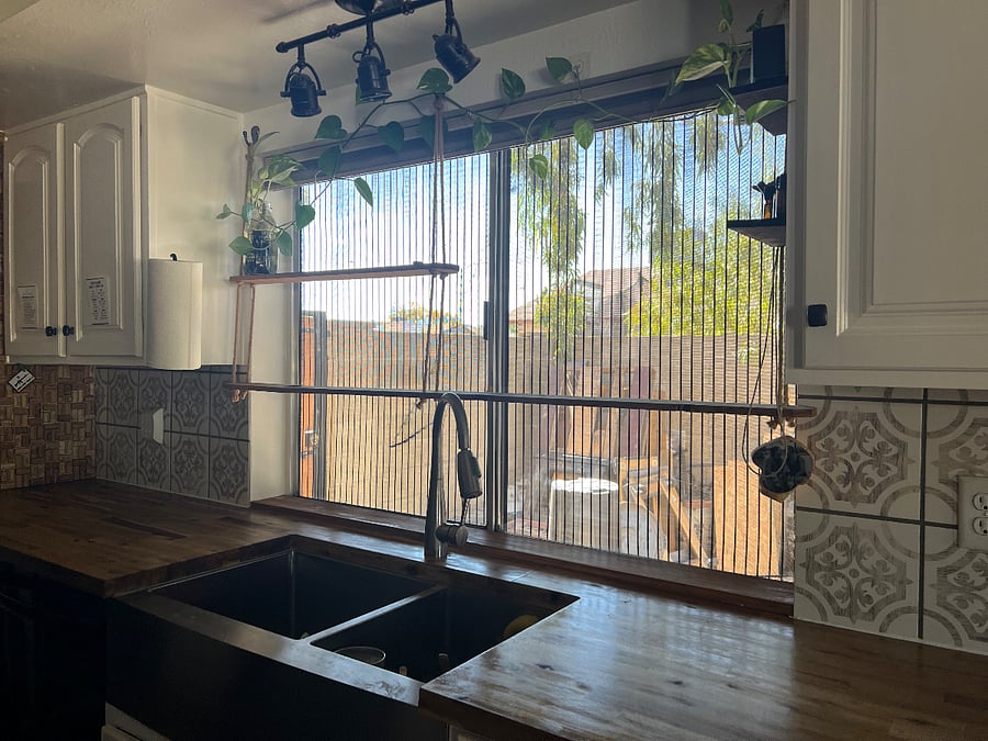 Kitchen farmhouse sink and window.
