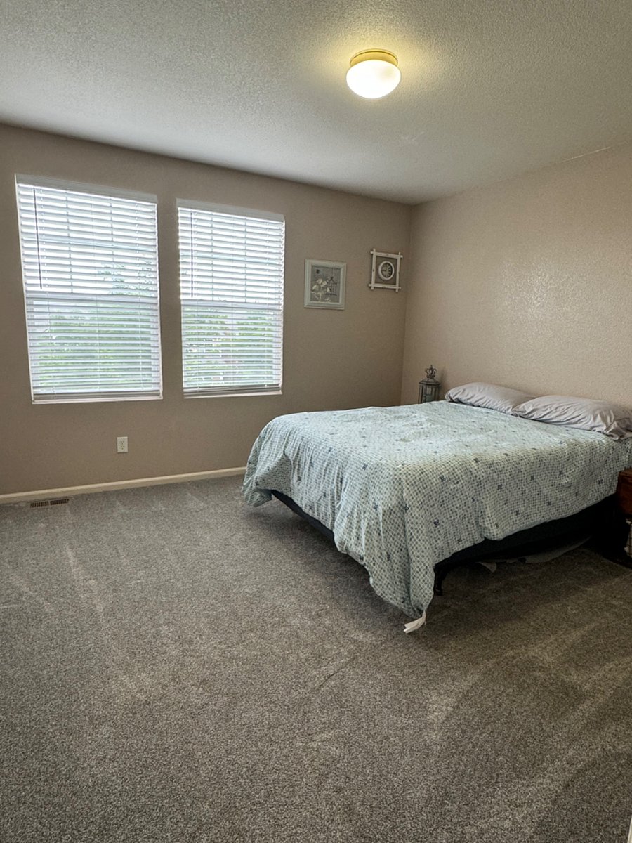 Second bedroom with queen bed and private bathroom