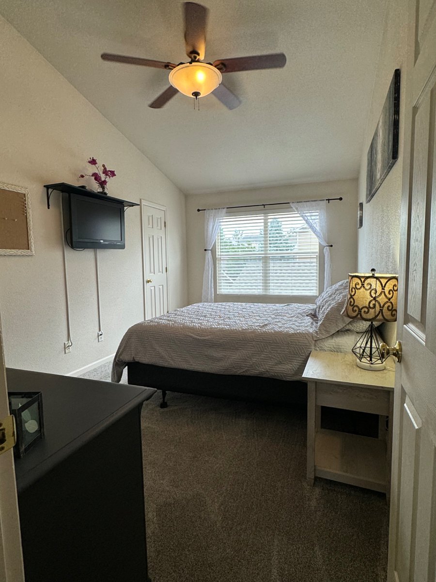 First bedroom with queen bed, walk in closet and 4 piece bathroom