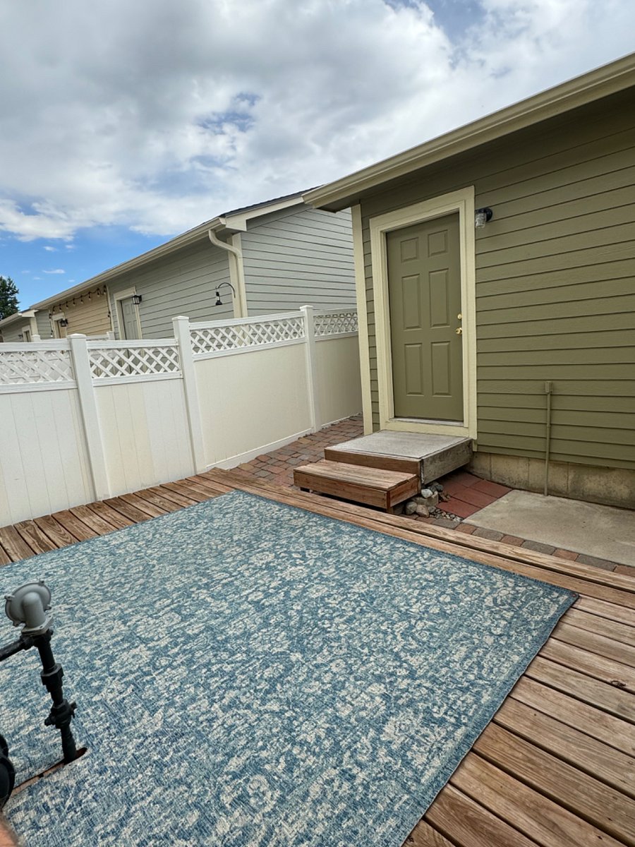Out the back door is a private patio area that leads to the detached garage