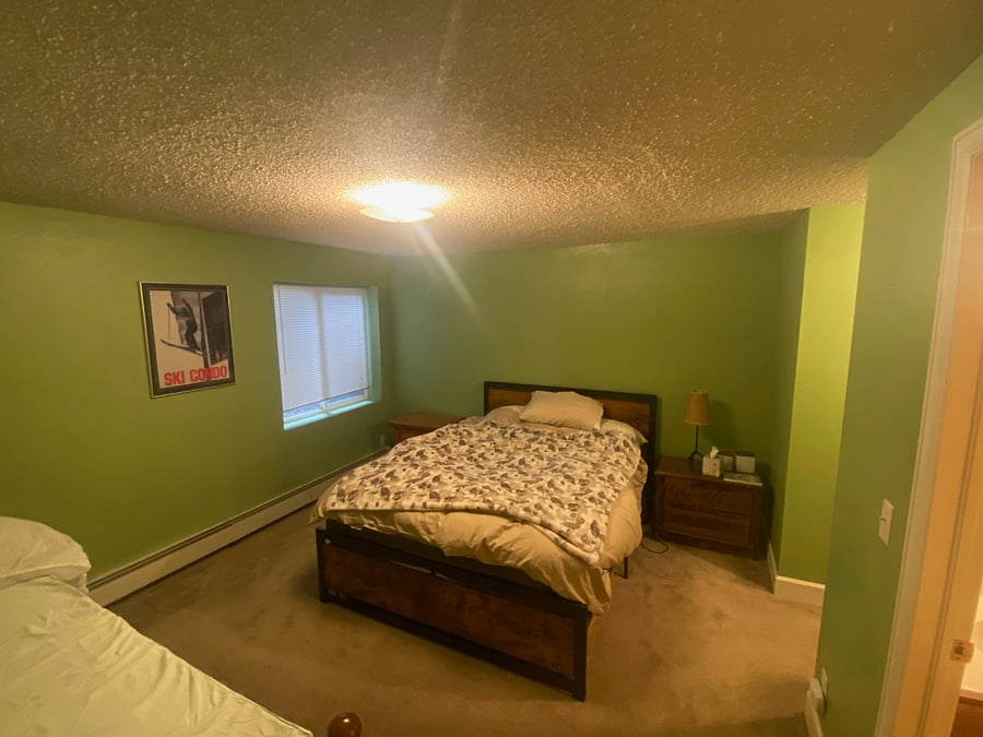 lower bedroom w/ large empty closet 