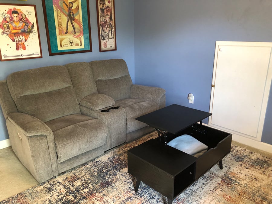 Reclining loveseat with head and foot adjustments & a lift top coffee table.