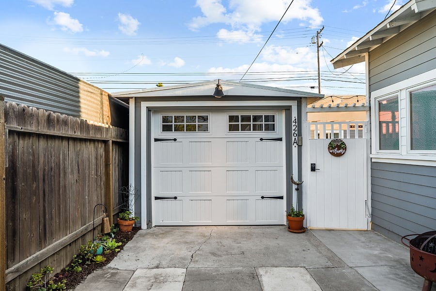 Private entrance to right of garage. Keypad entry. 