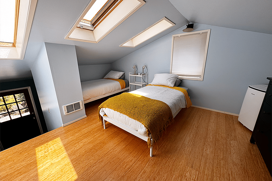 Upstairs bedroom with 2 twin beds (can be combined to 1 bed or remove 1 bed). Ceiling is low so recommend someone petite for this room.