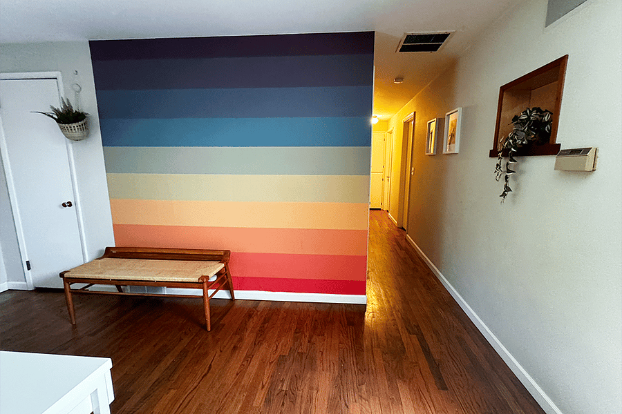 Living Room entrance looking down hallway to 3 bedrooms and 1 bathUp 