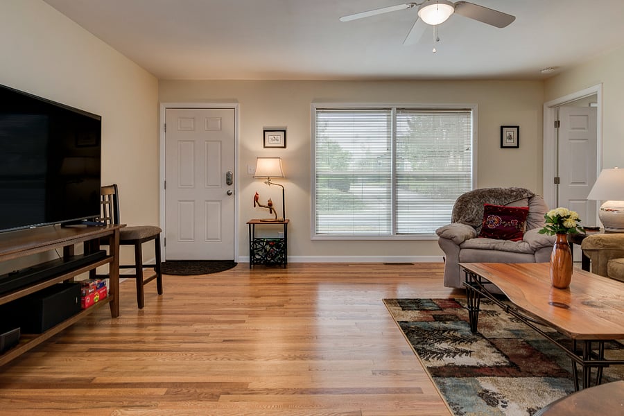 Spacious and comfortable living room with 65" Smart TV