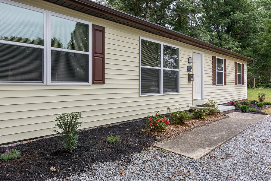 Nice walk way into the house and parking for two cars. Back yard is great for your dog includes patio set and lawn